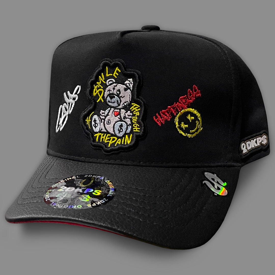 Gorra OSO SMILE THE PAIN VINIPIEL