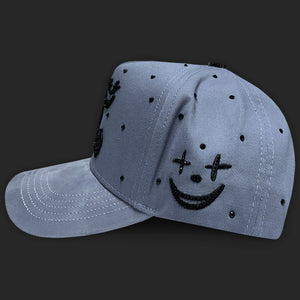 GORRA GC RICO O MUERTO GRIS